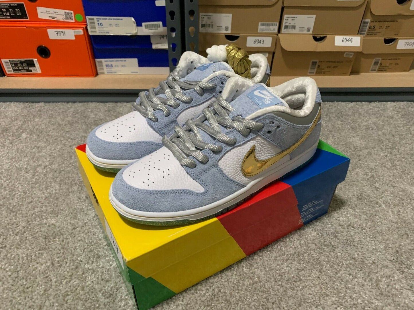 Sean Cliver x Nike SB Dunk Low “Holiday Special”